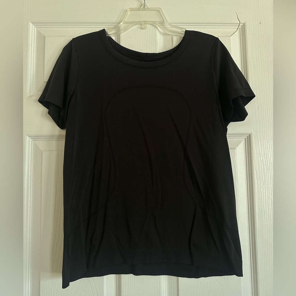 Women’s Swiftly Tech Short Sleeved Shirt. Great condition. Black, size 10.
